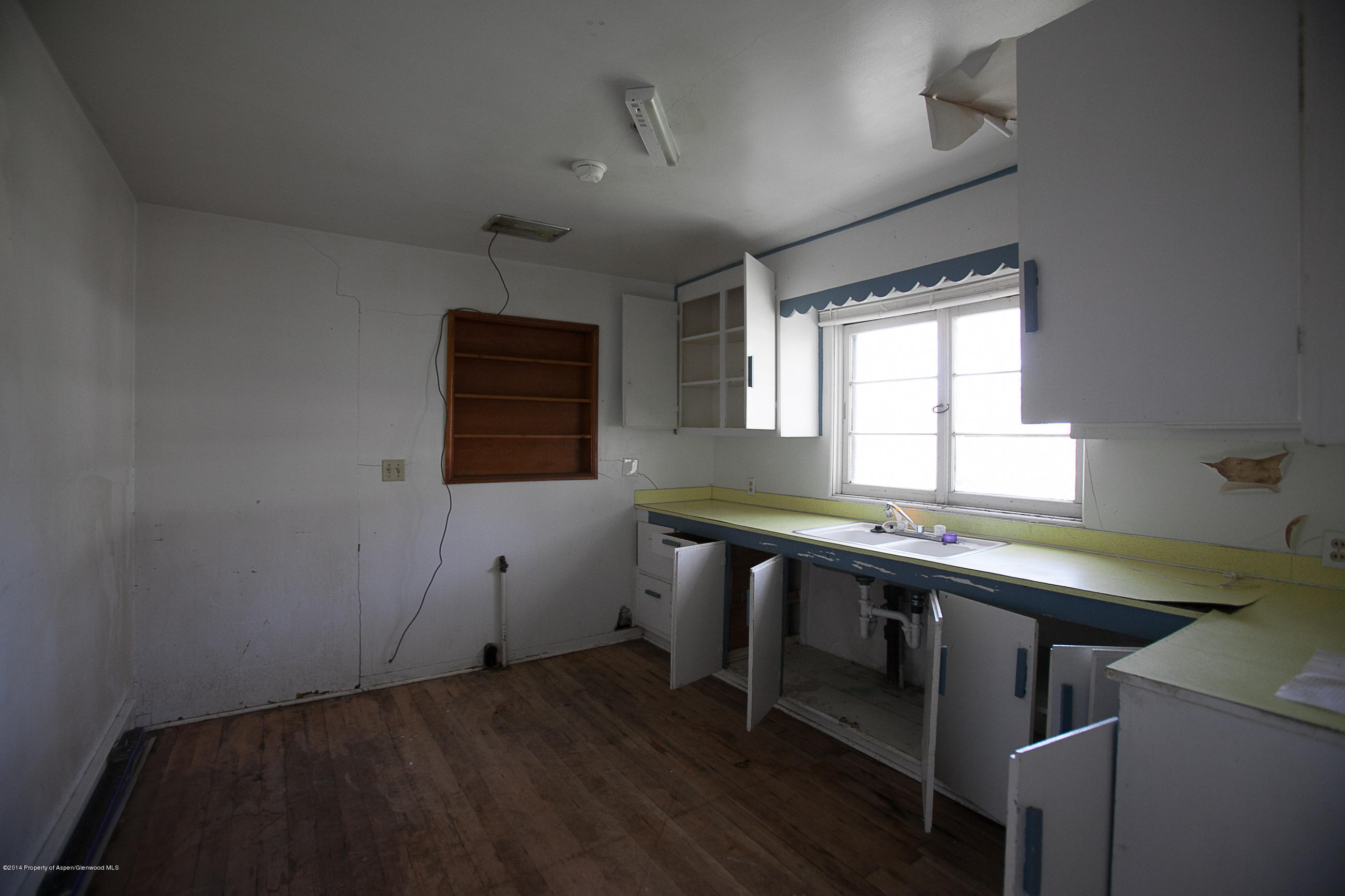 132 Ray Avenue Rifle, CO 81650 - Photo 3 of 10 a room with a table chairs and windows