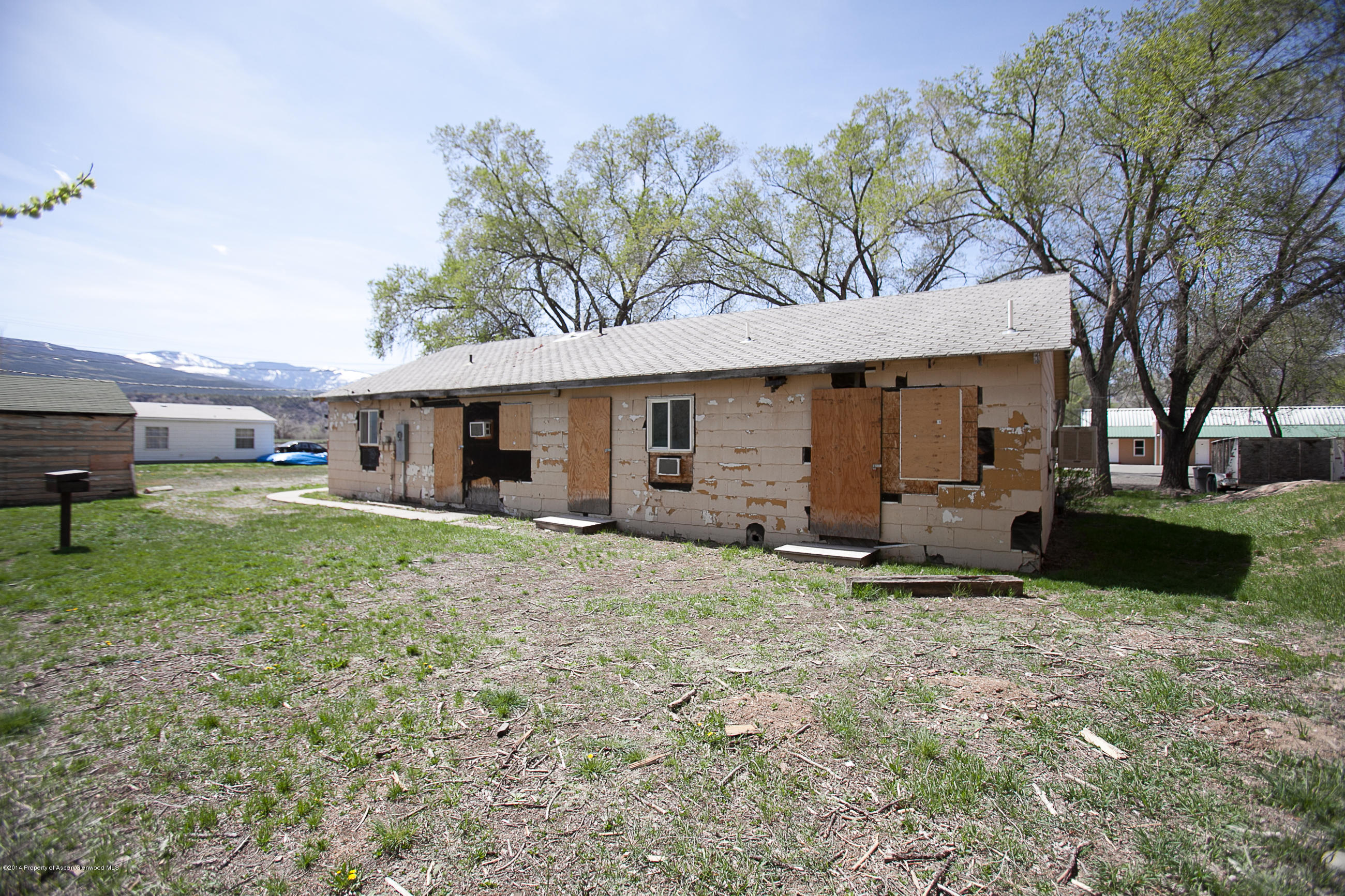 132 Ray Avenue Rifle, CO 81650 - Photo 10 of 10 a view of a house with a yard and a tree