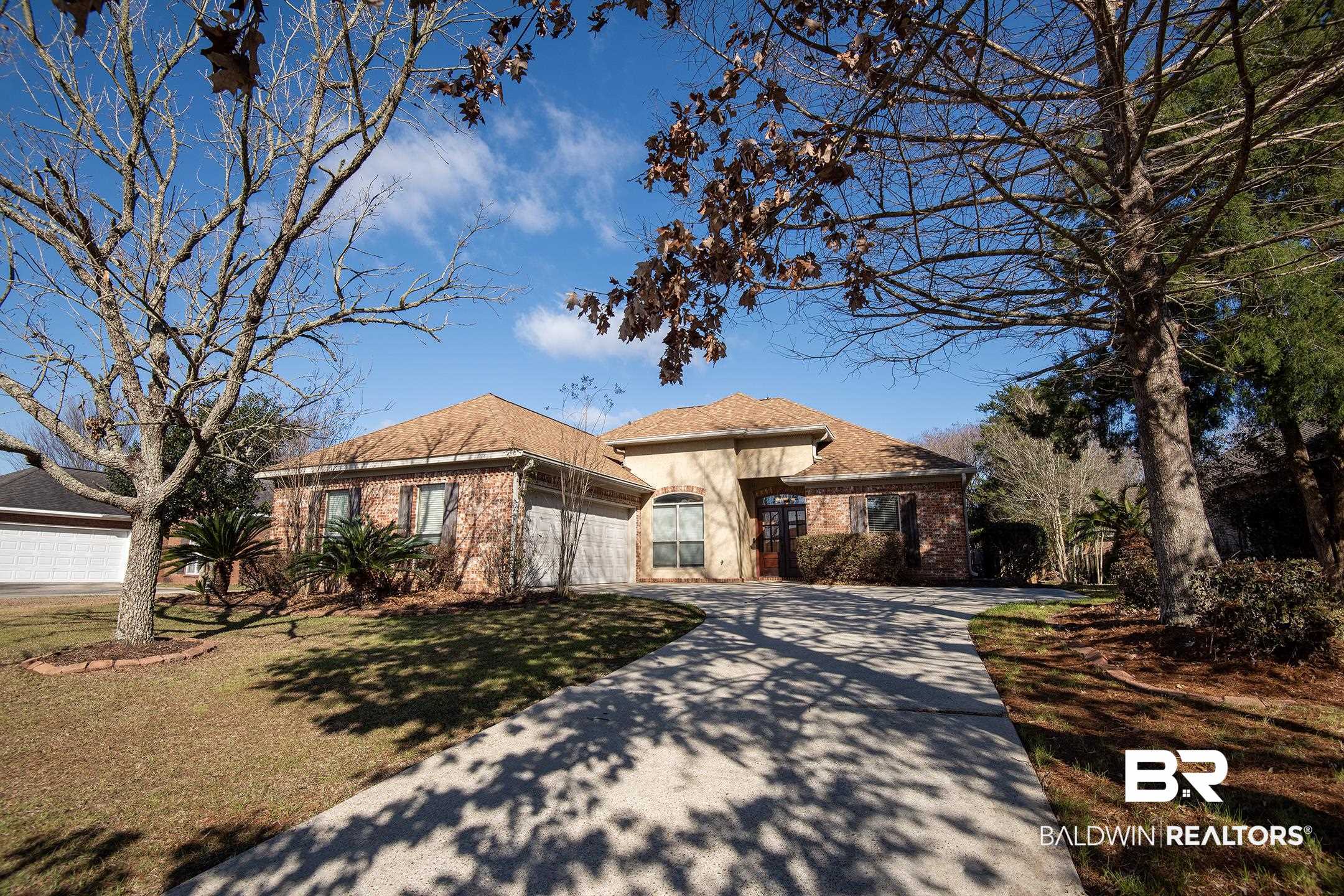 9421 Collier Loop Daphne, AL 36526 - Photo 2 of 31 View of front of home with concrete driveway, a front lawn, brick siding, and a shingled roof