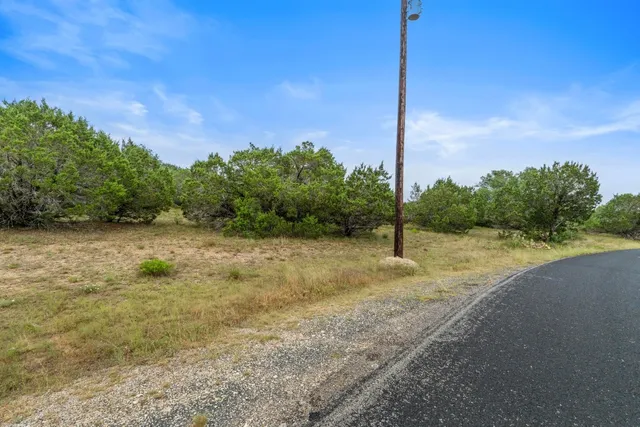 a view of a road with a yard