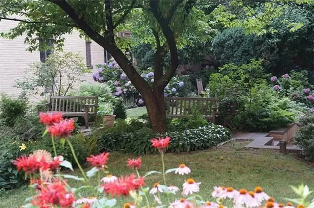 a kitchen with white cabinets and sink