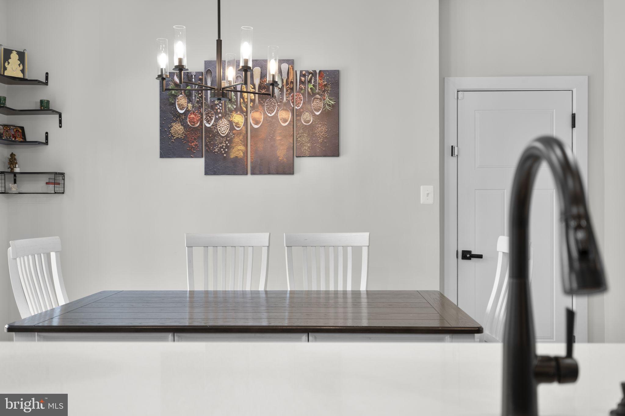 1713 Aurora Way Frederick, MD 21702 - Photo 24 of 57 a view of a dining room with furniture and chandelier