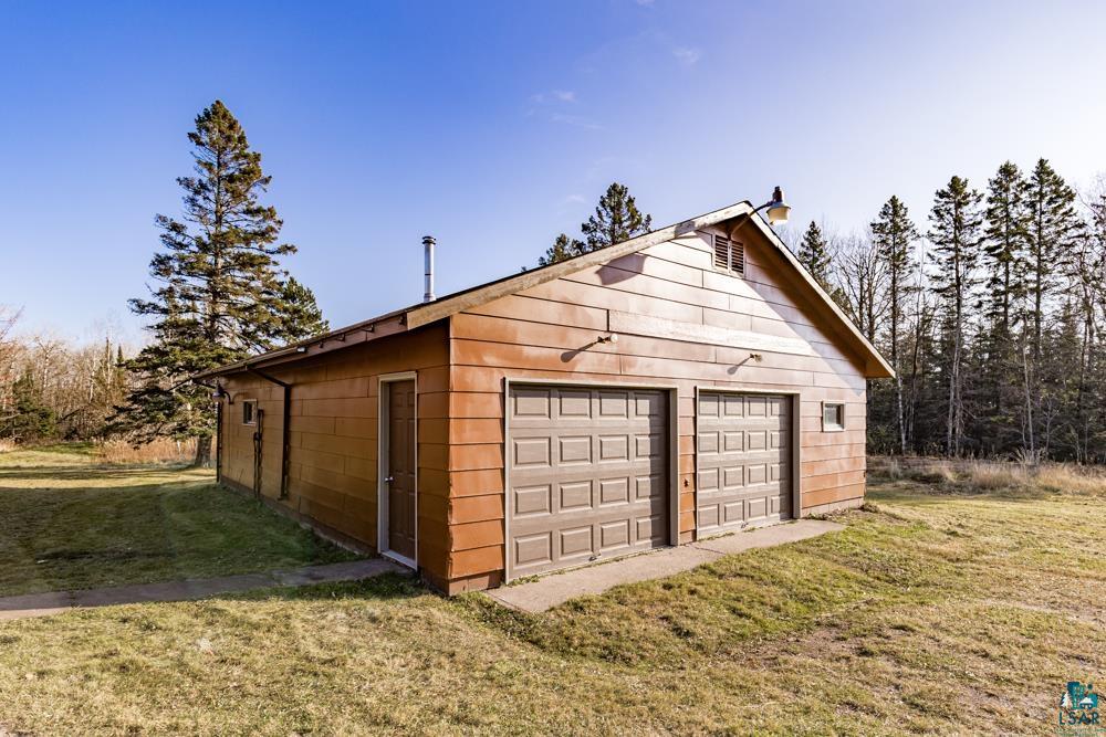 1148 Shoreview Road Two Harbors, MN 55616 - Photo 35 of 48 Garage featuring a lawn