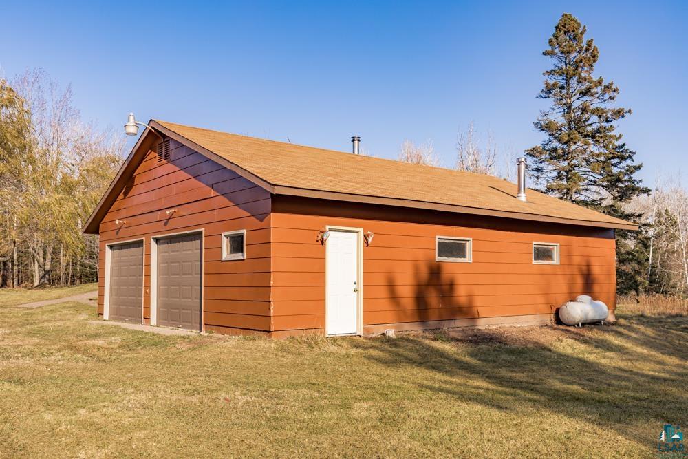1148 Shoreview Road Two Harbors, MN 55616 - Photo 4 of 48 View of outbuilding with a yard and a garage