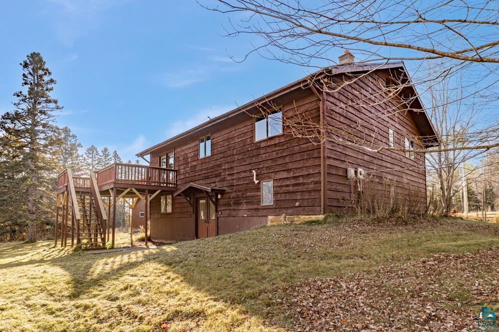 1148 Shoreview Road Two Harbors, MN 55616 - Photo 42 of 48 View of side of property featuring a lawn and a wooden deck