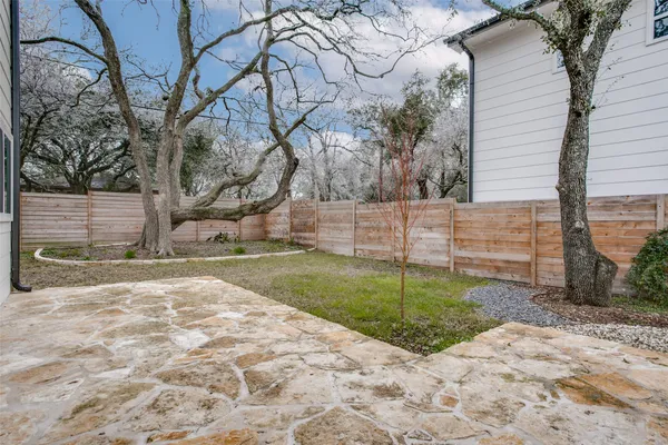 a view of a back yard of the house
