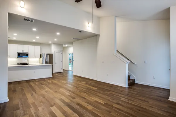 a view of kitchen with cabinets and wooden floor