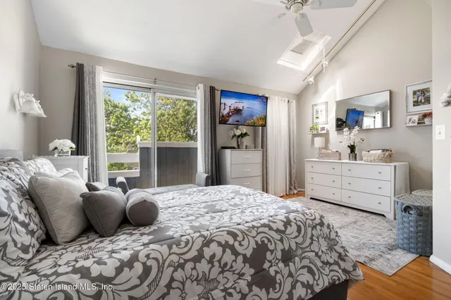 a bedroom with a large bed and a window