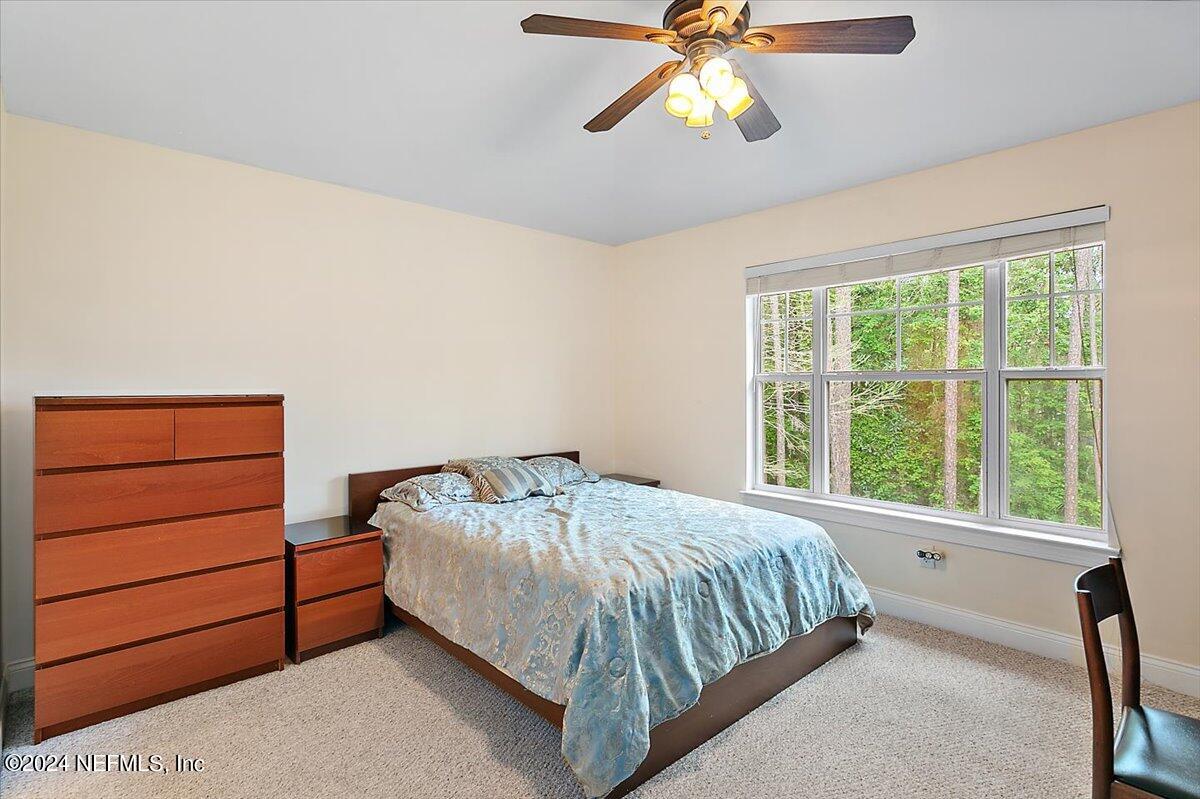160 Legendary Drive, Unit 206 St. Augustine, FL 32092 - Photo 9 of 20 a bedroom with a bed and window