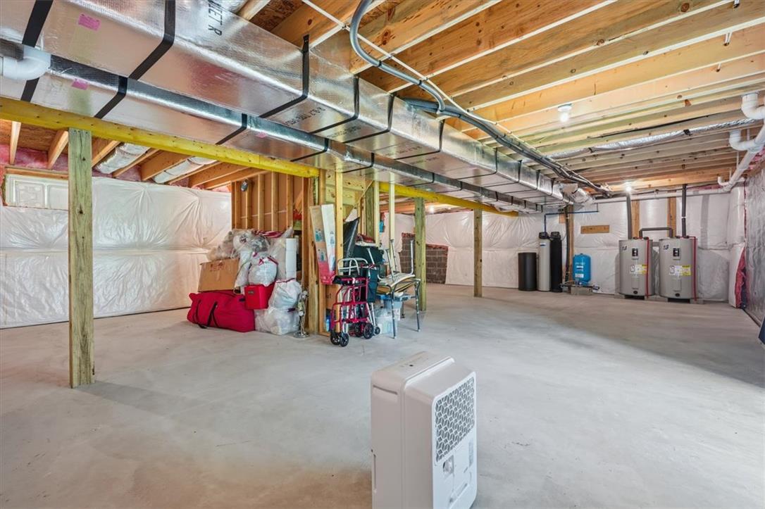 5032 Custard Road Stroudsburg, PA 18360 - Photo 59 of 80 Exposed wood joists and concrete floors define this expansive unfinished lower level.