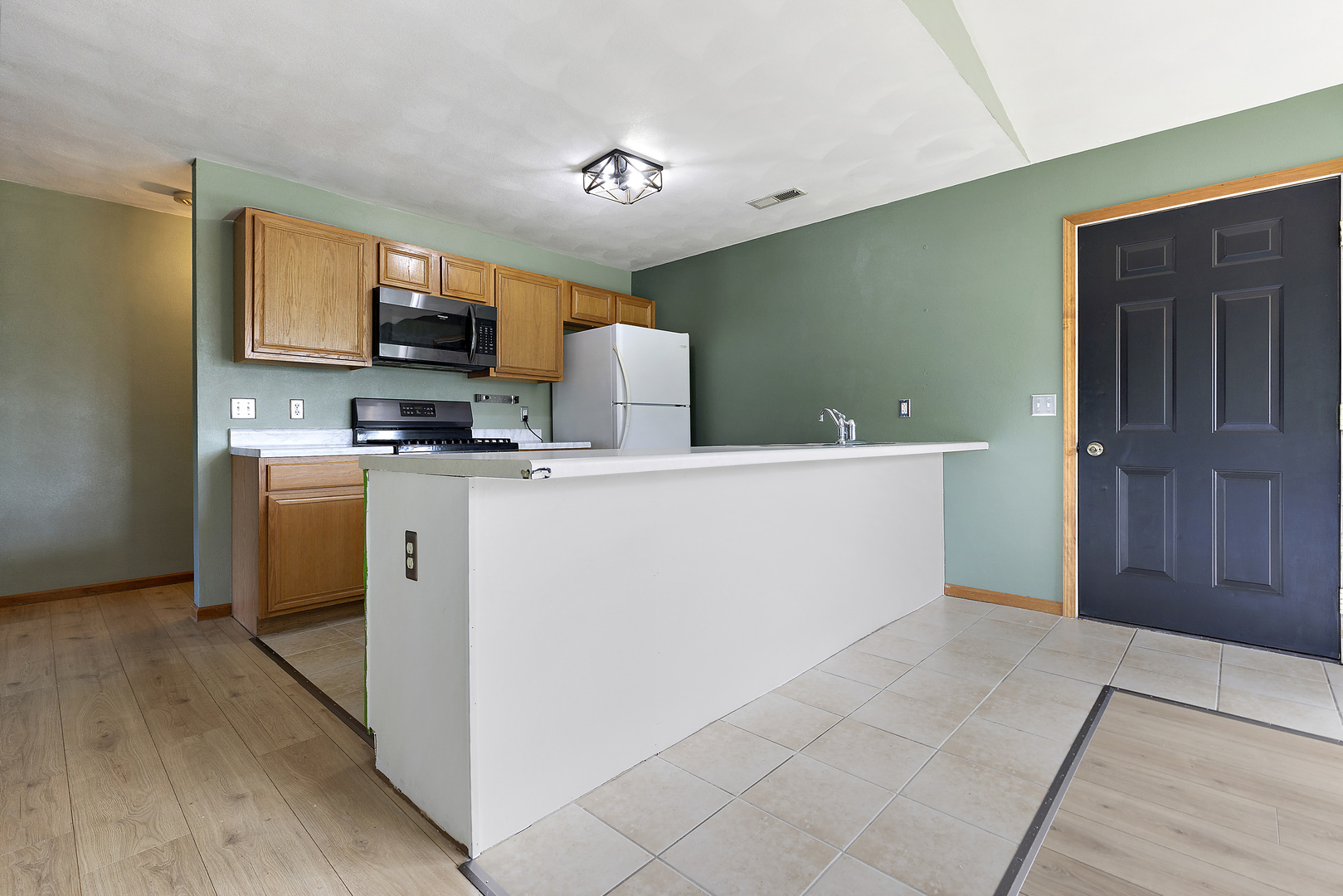 10050 Skipperling Road, Unit 1 Roscoe, IL 61073 - Photo 5 of 15 a utility room with cabinets washer and dryer