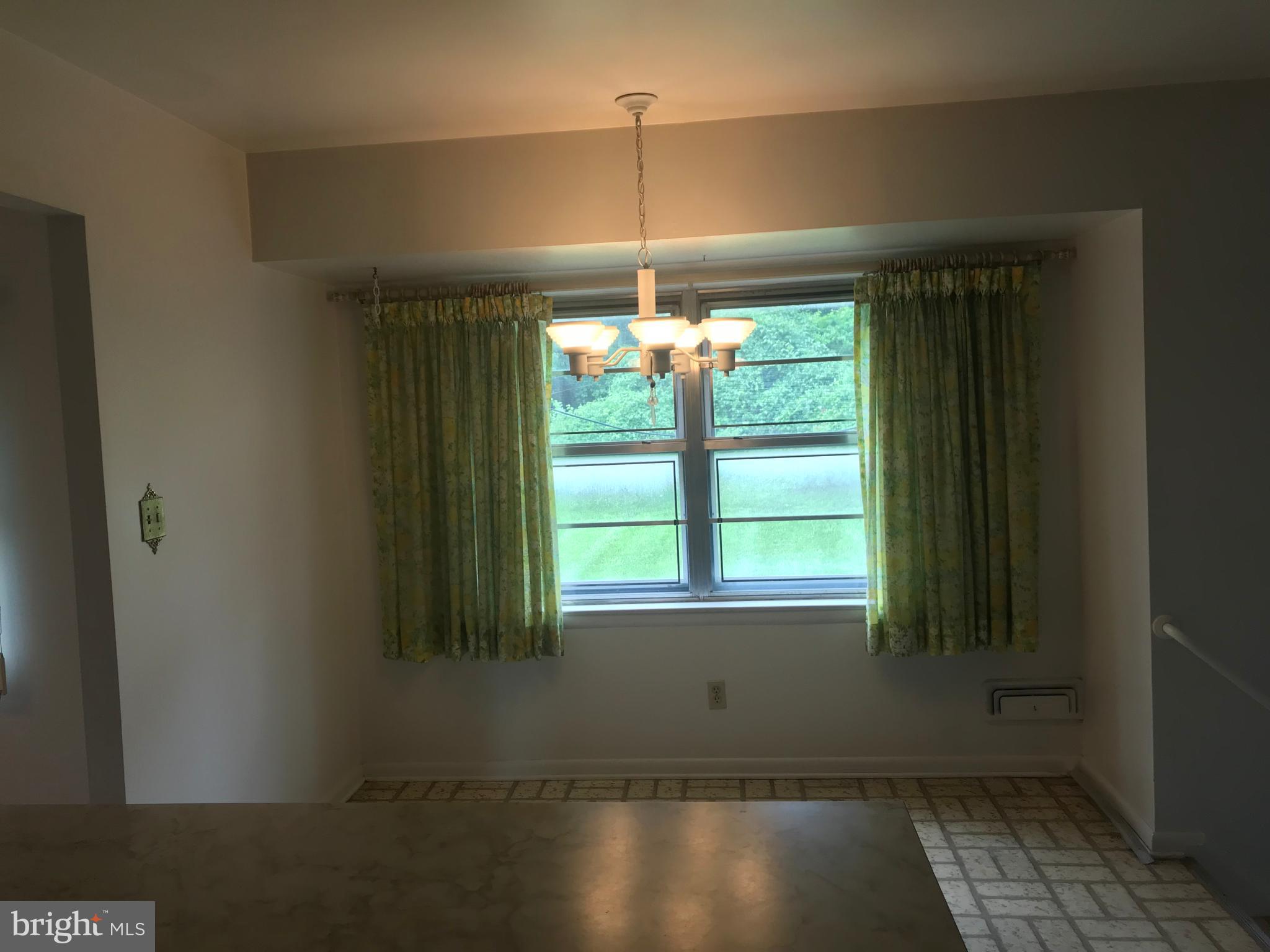 810 Smoke Tree Road Baltimore, MD 21208 - Photo 12 of 25 kitchen breakfast area overlooking lush rear yard