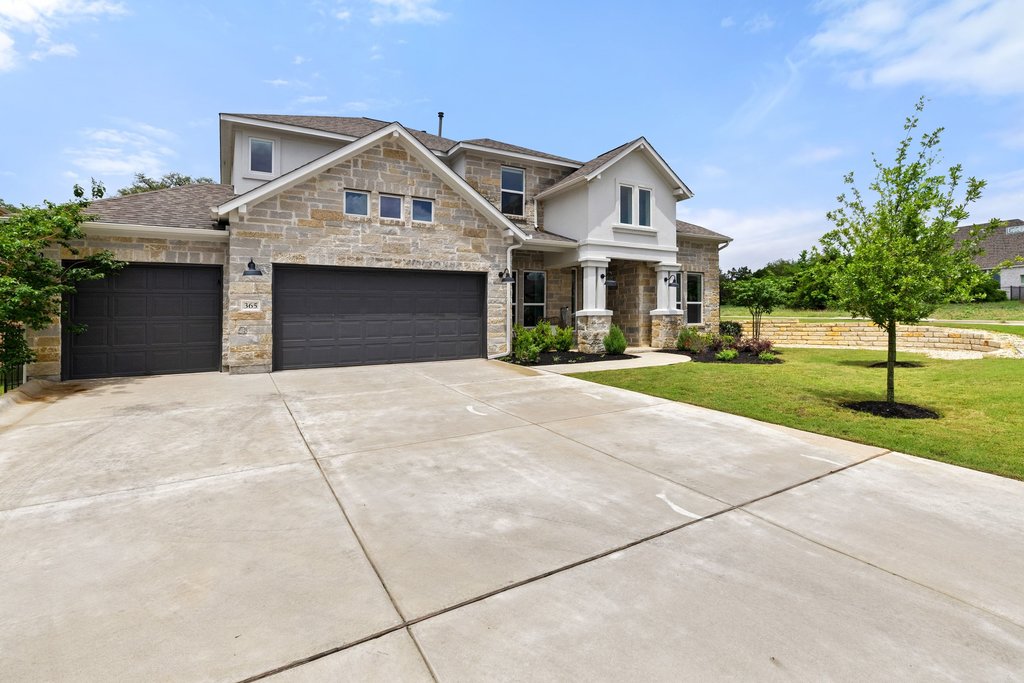365 Pear Tree Lane Austin, TX 78737 - Photo 2 of 39 a front view of a house with a yard