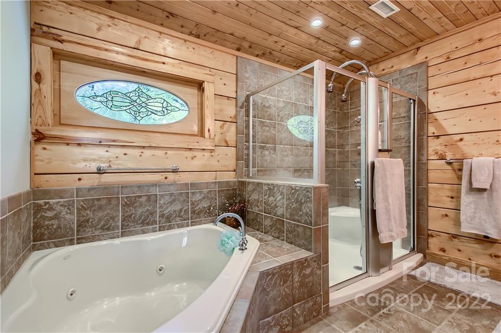 8754 Riverwood Road Terrell, NC 28682 - Photo 20 of 48 a bathroom with a bathtub and a shower