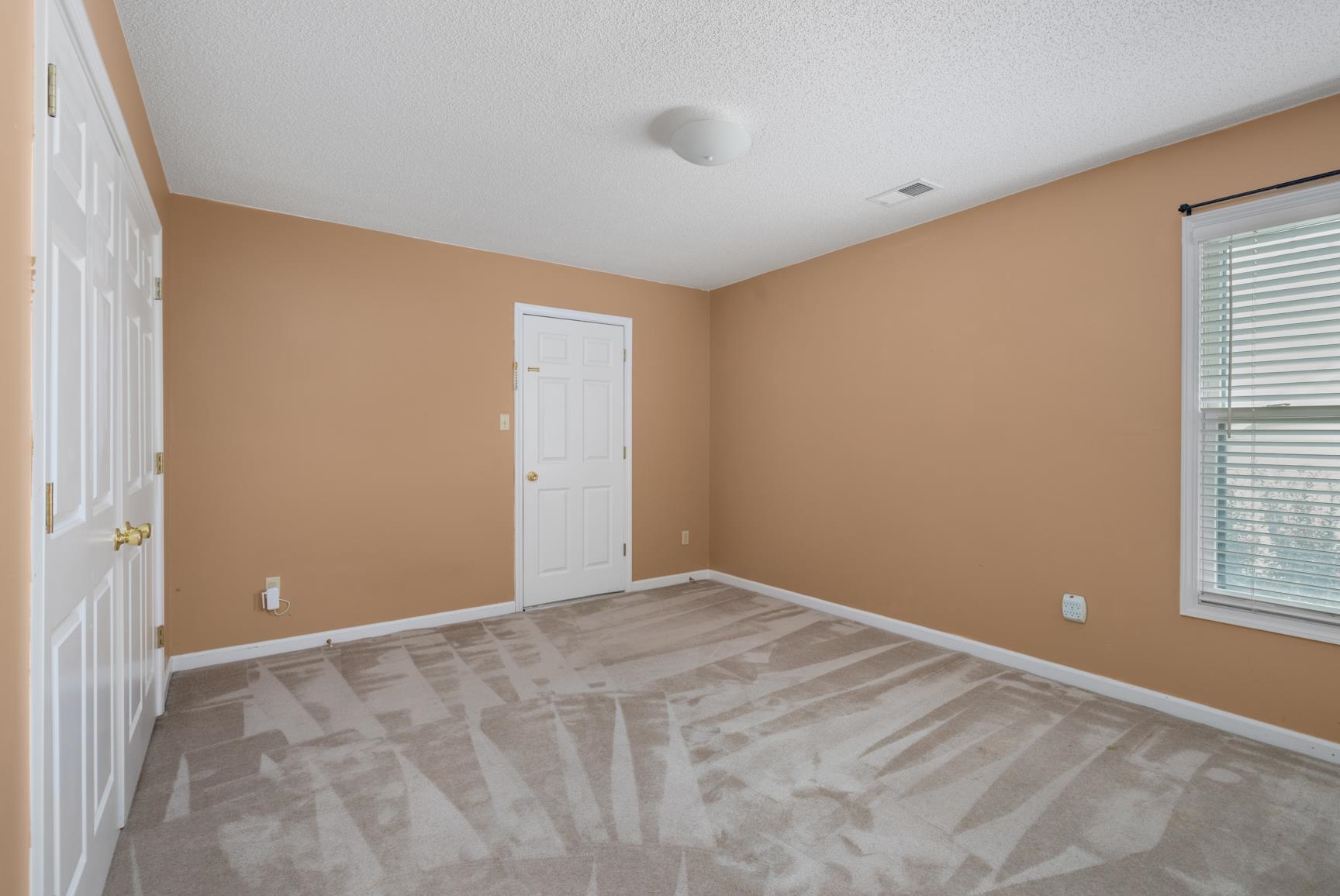 9015 Raspberry Lane Cordova, TN 38016 - Photo 32 of 40 Unfurnished room featuring light carpet and a textured ceiling