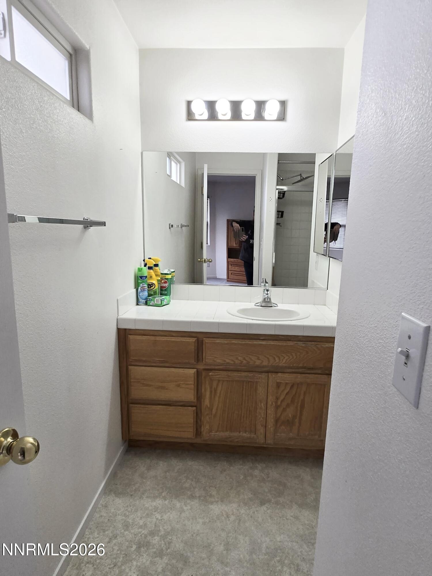 476 Jennys Lane Fernley, NV 89408 - Photo 20 of 29 a bathroom with a double vanity sink and a mirror