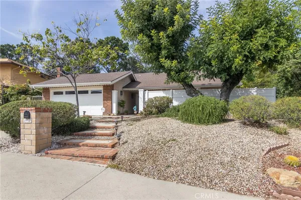 front view of a house with a small yard