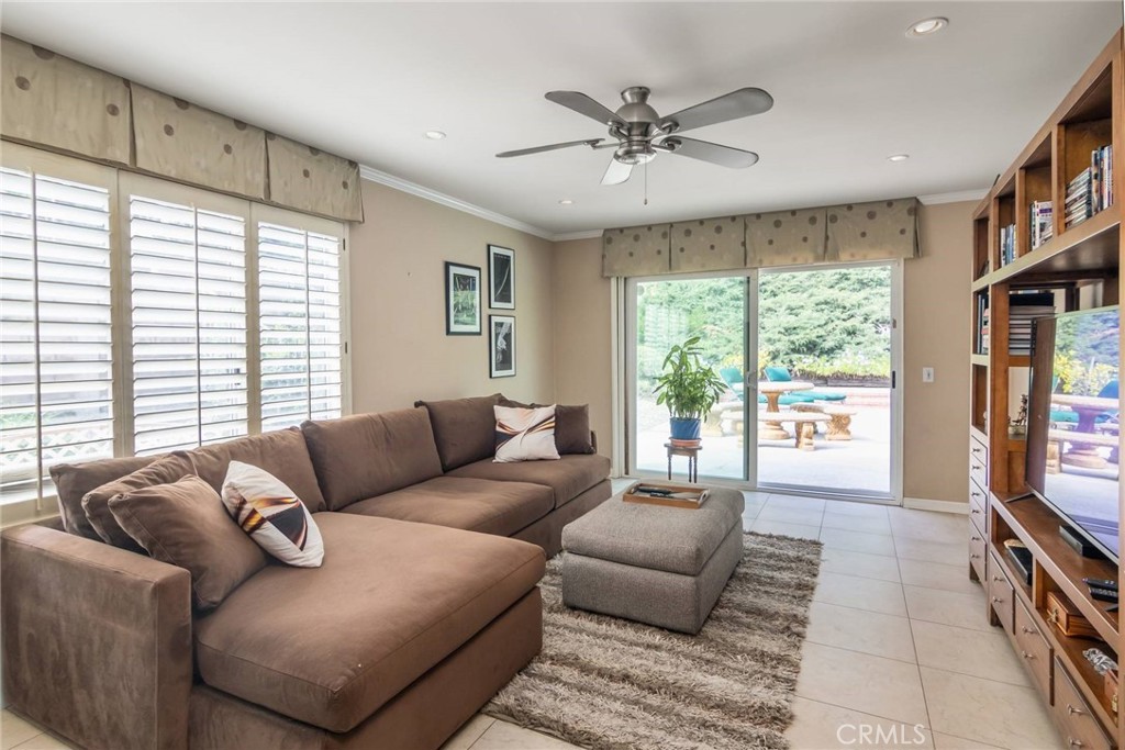 19343 Pauma Valley Drive Porter Ranch, CA 91326 - Photo 11 of 28 a living room with furniture and a flat screen tv