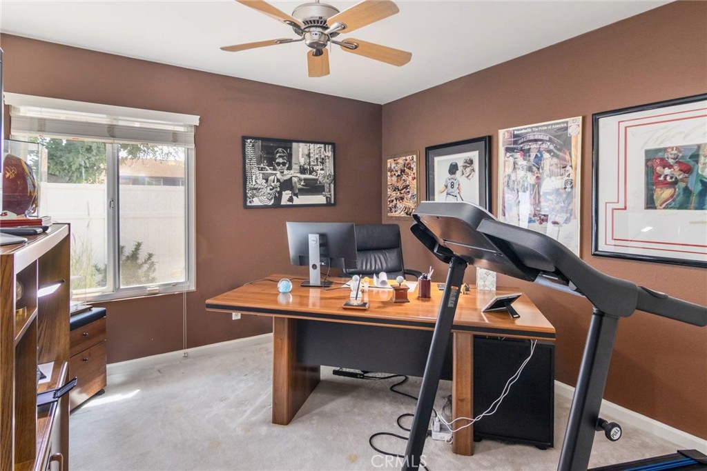 19343 Pauma Valley Drive Porter Ranch, CA 91326 - Photo 19 of 28 a view of a workspace with furniture and a window