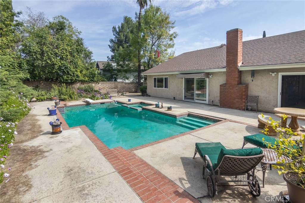19343 Pauma Valley Drive Porter Ranch, CA 91326 - Photo 23 of 28 a house with garden in front of it