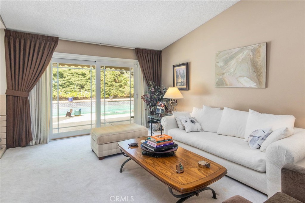 19343 Pauma Valley Drive Porter Ranch, CA 91326 - Photo 6 of 28 a living room with furniture and a large window