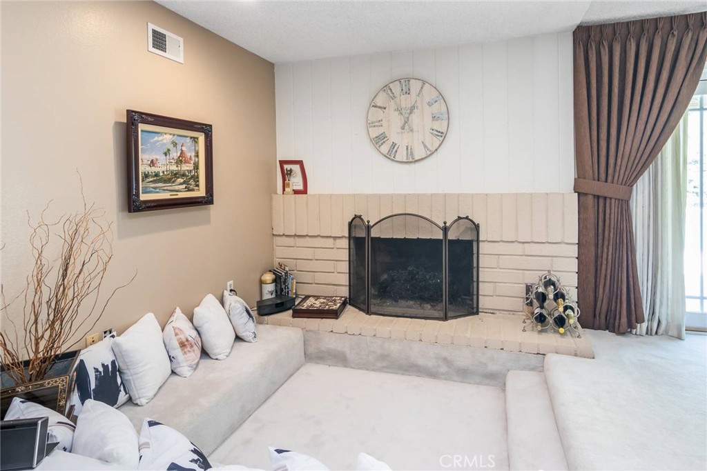 19343 Pauma Valley Drive Porter Ranch, CA 91326 - Photo 7 of 28 a living room with furniture a mirror and a window