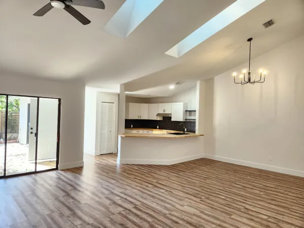 a view of a kitchen with a sink and dishwasher