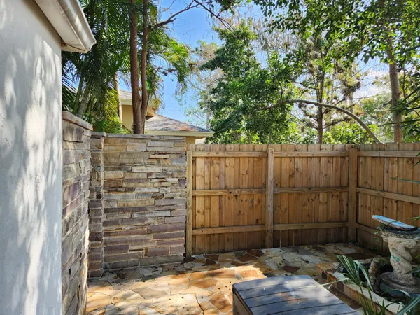 a view of a house with a tree beside it