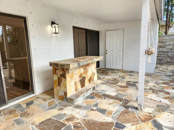 a view of a house with a tree