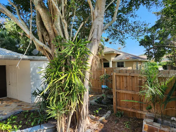 a front view of a house with outdoor seating