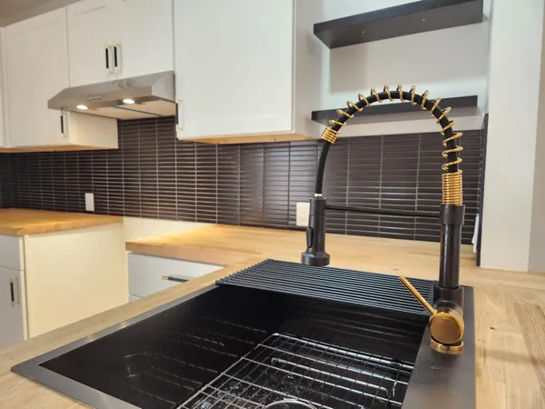 a bathroom with a sink and a window