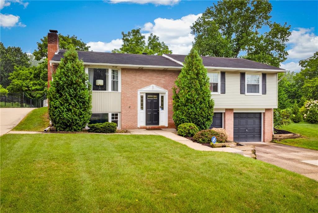 272 Hays Road Pittsburgh, PA 15241 - Photo 1 of 43 Charming exterior view featuring the front facade, manicured front lawn, and concrete driveway leading to the home.