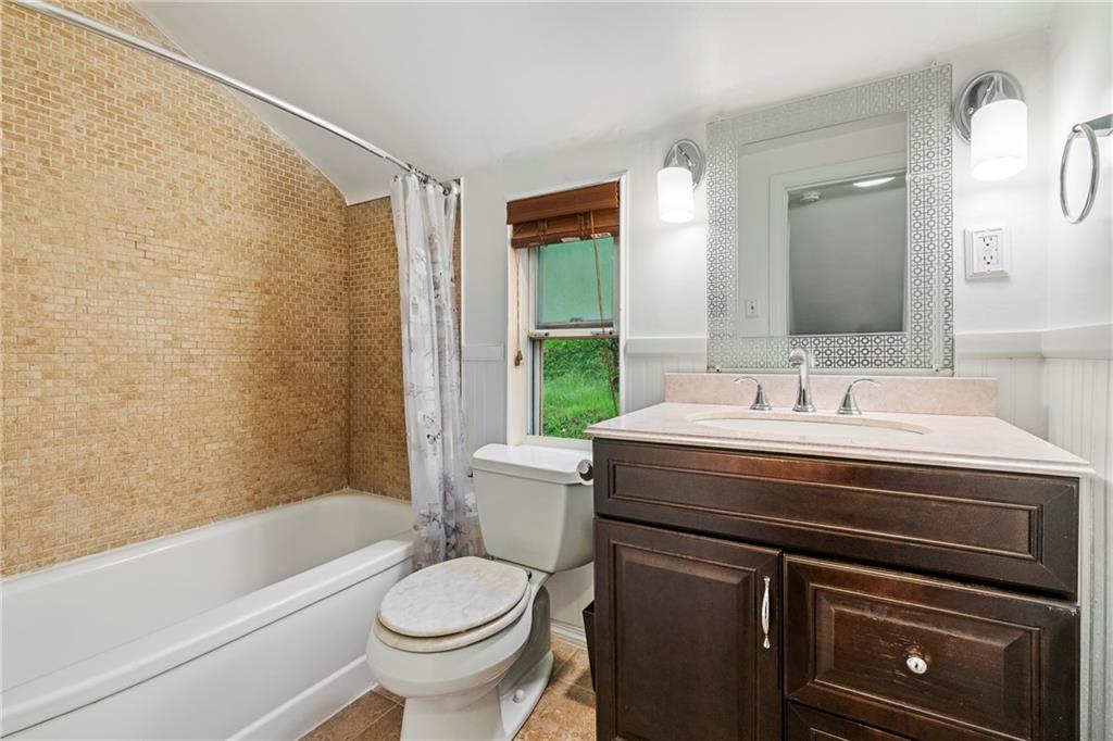 435 Filmore Road Pittsburgh, PA 15221 - Photo 18 of 37 Updated bath with beautiful ceramic tile and new sink fixture.