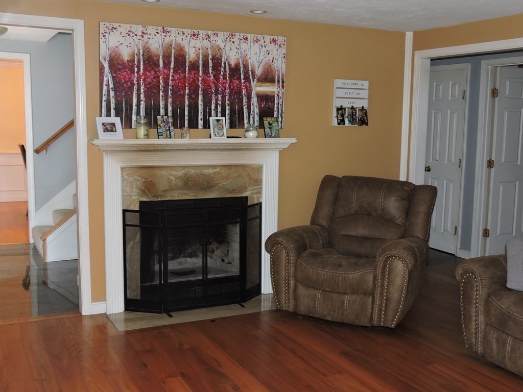 120 North Sturbridge Road Charlton, MA 01507 - Photo 21 of 39 a living room with furniture and a fireplace