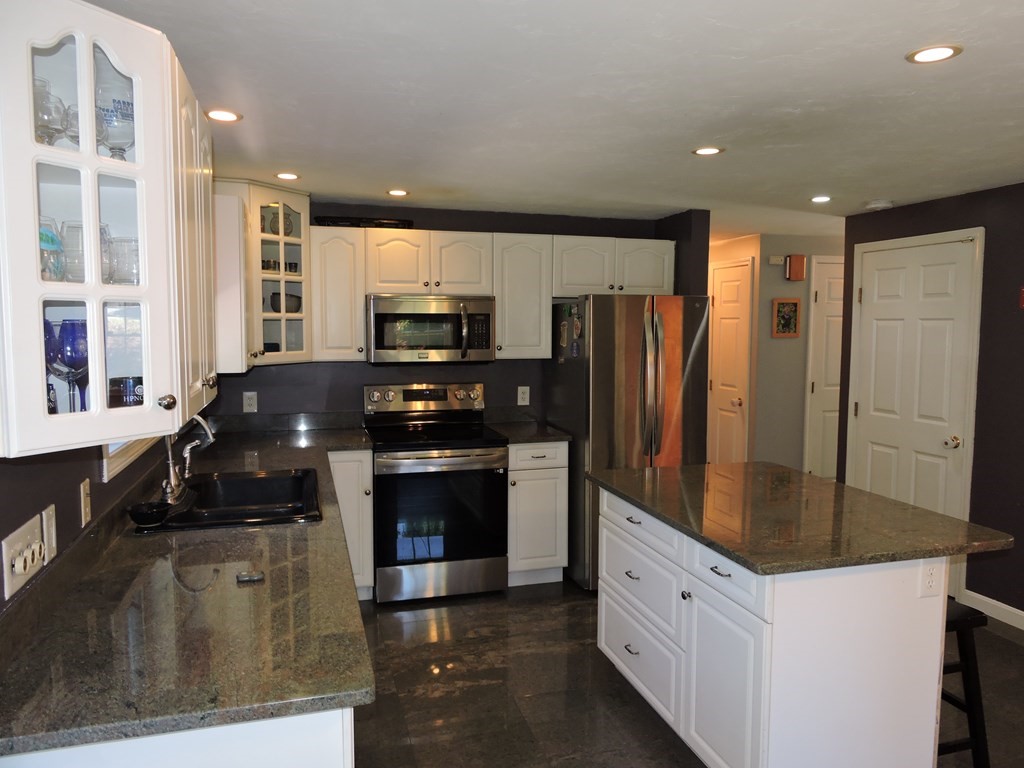 120 North Sturbridge Road Charlton, MA 01507 - Photo 3 of 39 a kitchen with granite countertop a refrigerator stove and sink