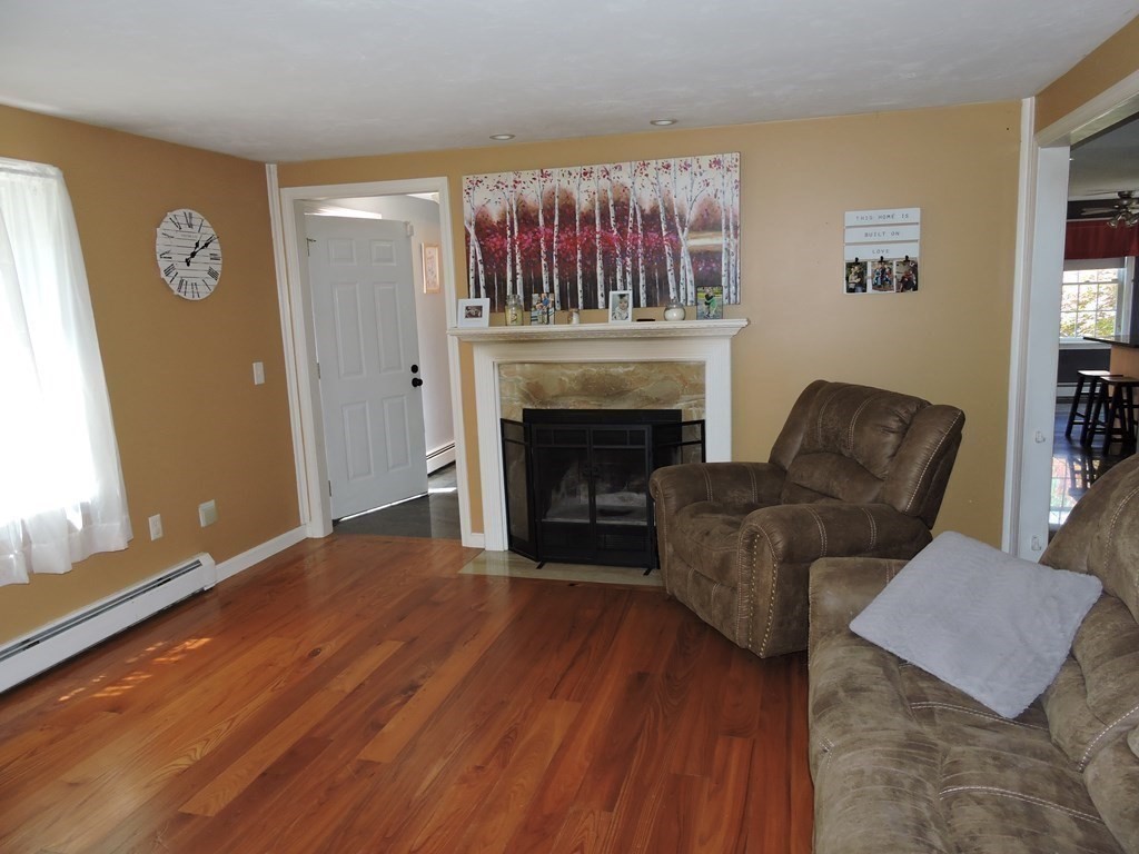 120 North Sturbridge Road Charlton, MA 01507 - Photo 33 of 39 a living room with furniture and a fireplace