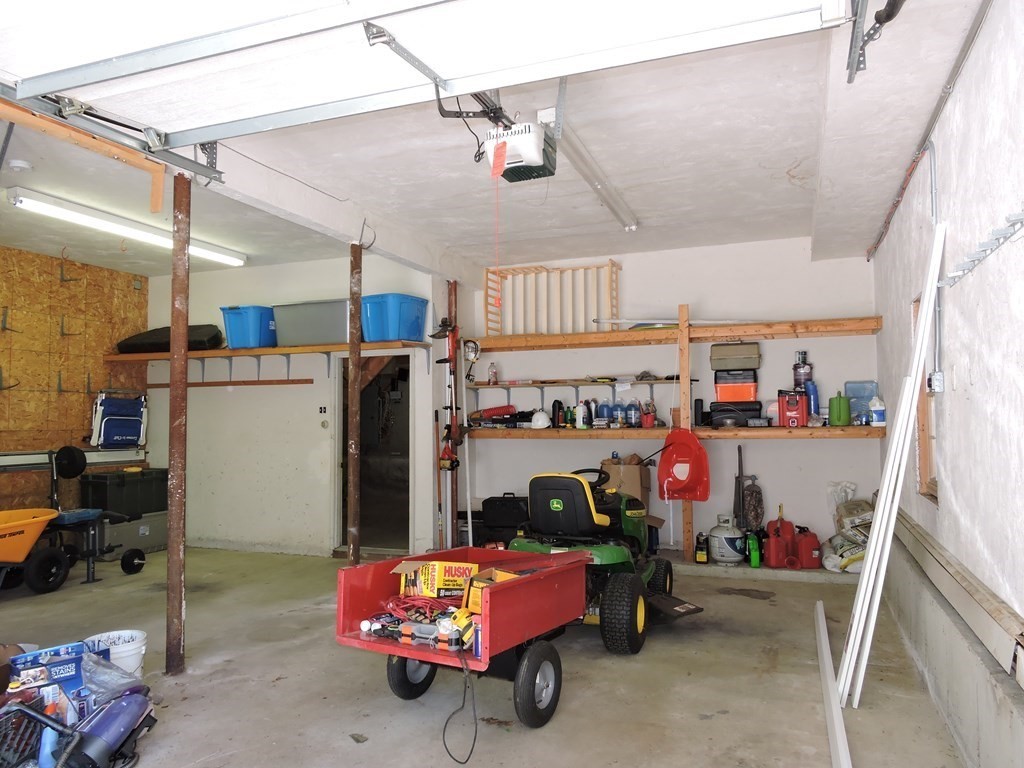 120 North Sturbridge Road Charlton, MA 01507 - Photo 34 of 39 a garage with storage and utility