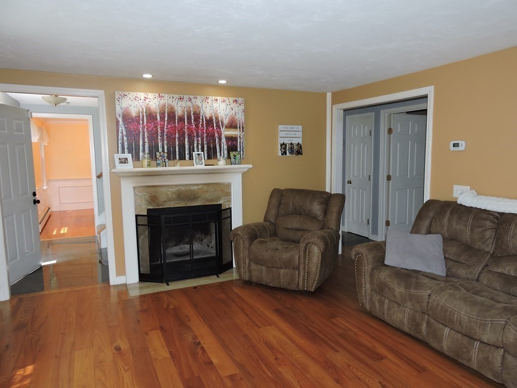 120 North Sturbridge Road Charlton, MA 01507 - Photo 5 of 39 a living room with furniture and a fireplace