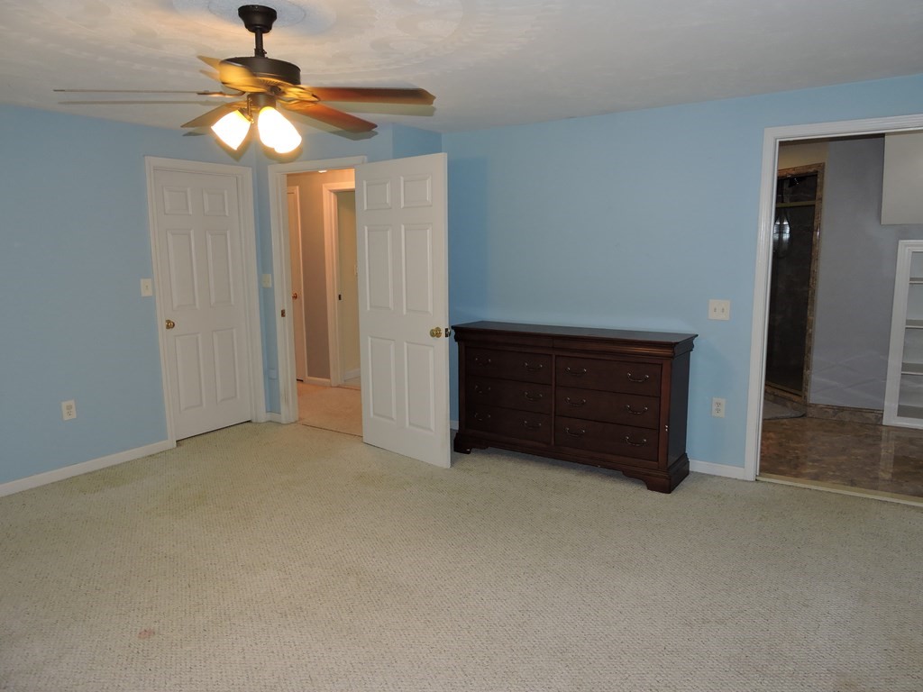 120 North Sturbridge Road Charlton, MA 01507 - Photo 9 of 39 an empty room with windows and fan