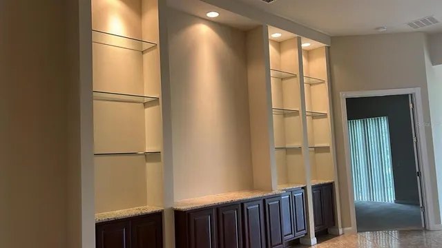 a view of a refrigerator in kitchen and wooden floor