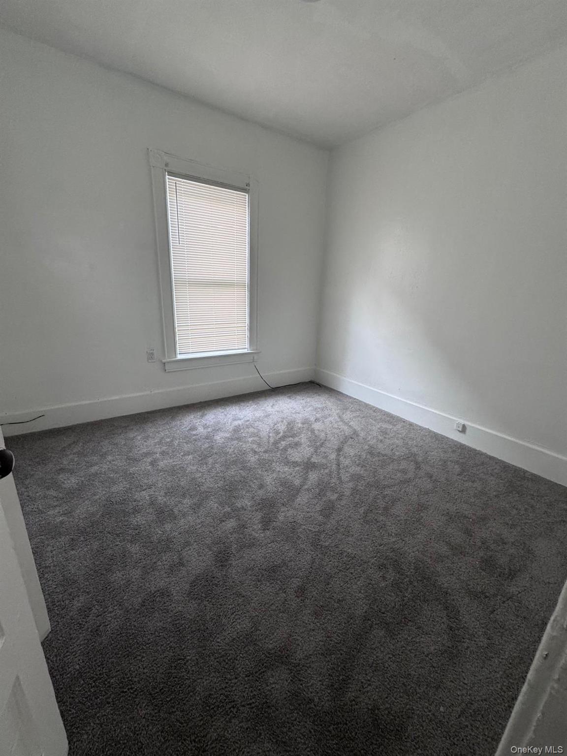 362 Church Street, Unit #2 Poughkeepsie, NY 12601 - Photo 11 of 18 an empty room with a window