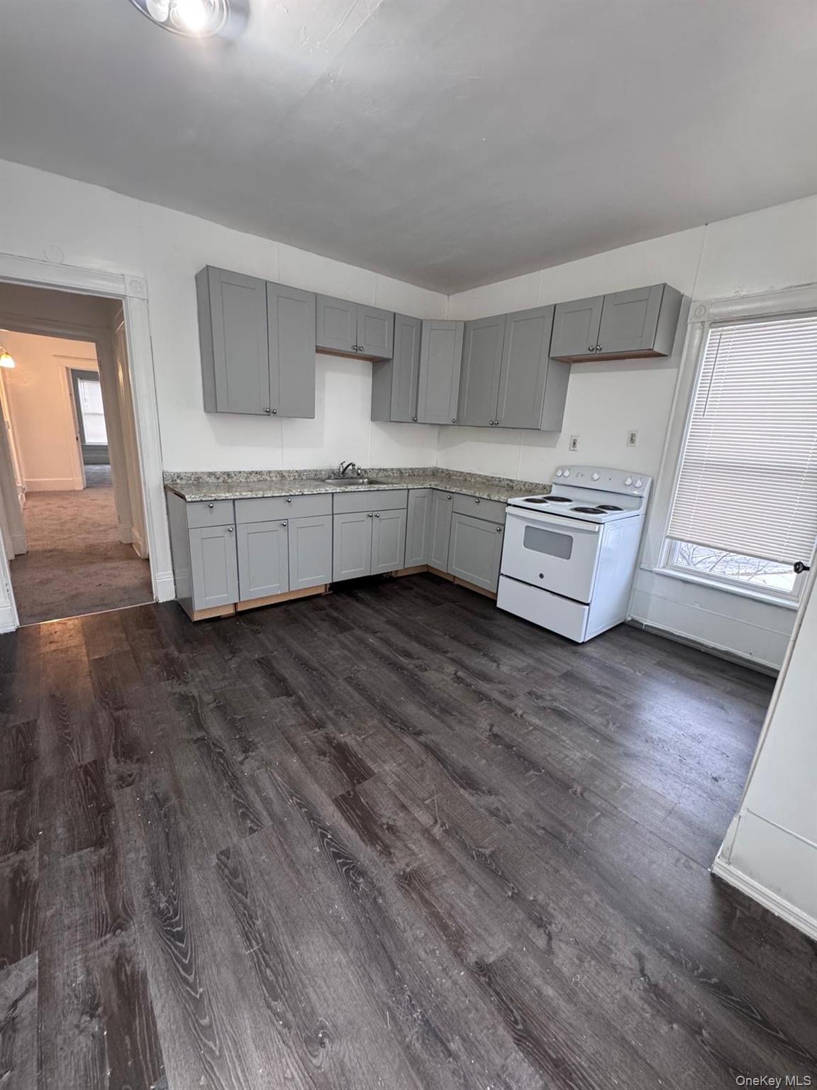 362 Church Street, Unit #2 Poughkeepsie, NY 12601 - Photo 16 of 18 a living room with furniture and hard wood flooring