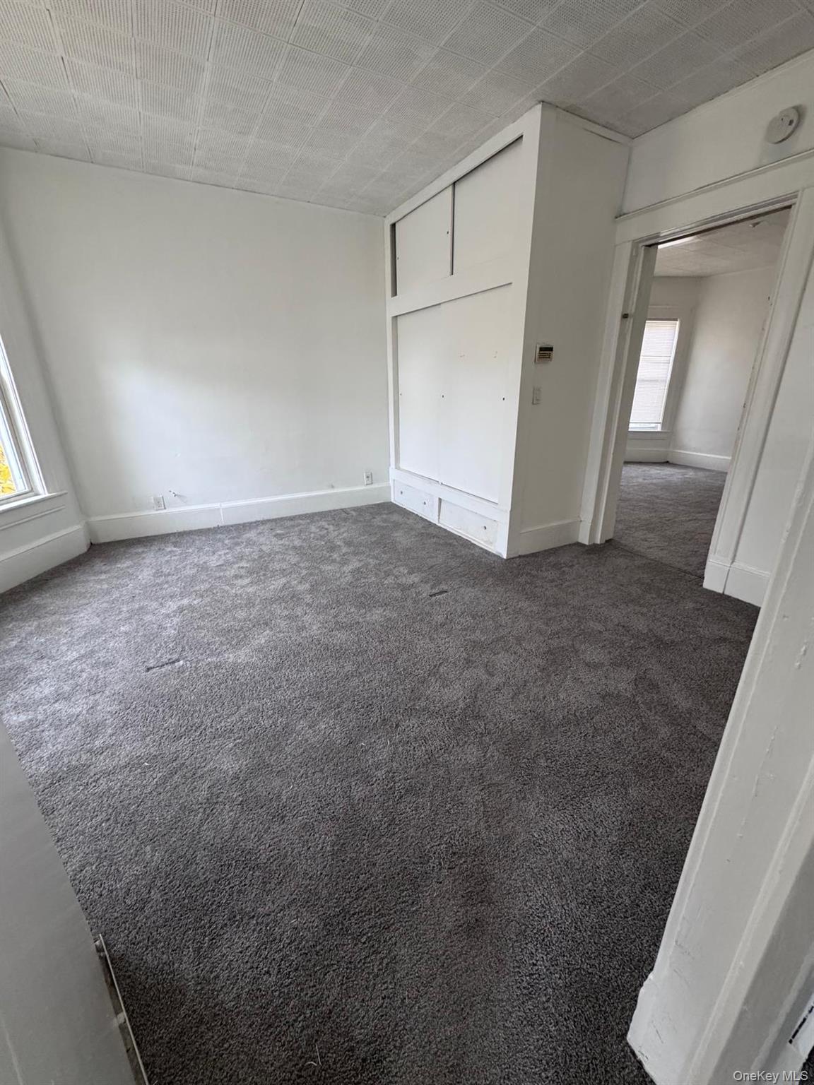 362 Church Street, Unit #2 Poughkeepsie, NY 12601 - Photo 3 of 18 an empty room with windows
