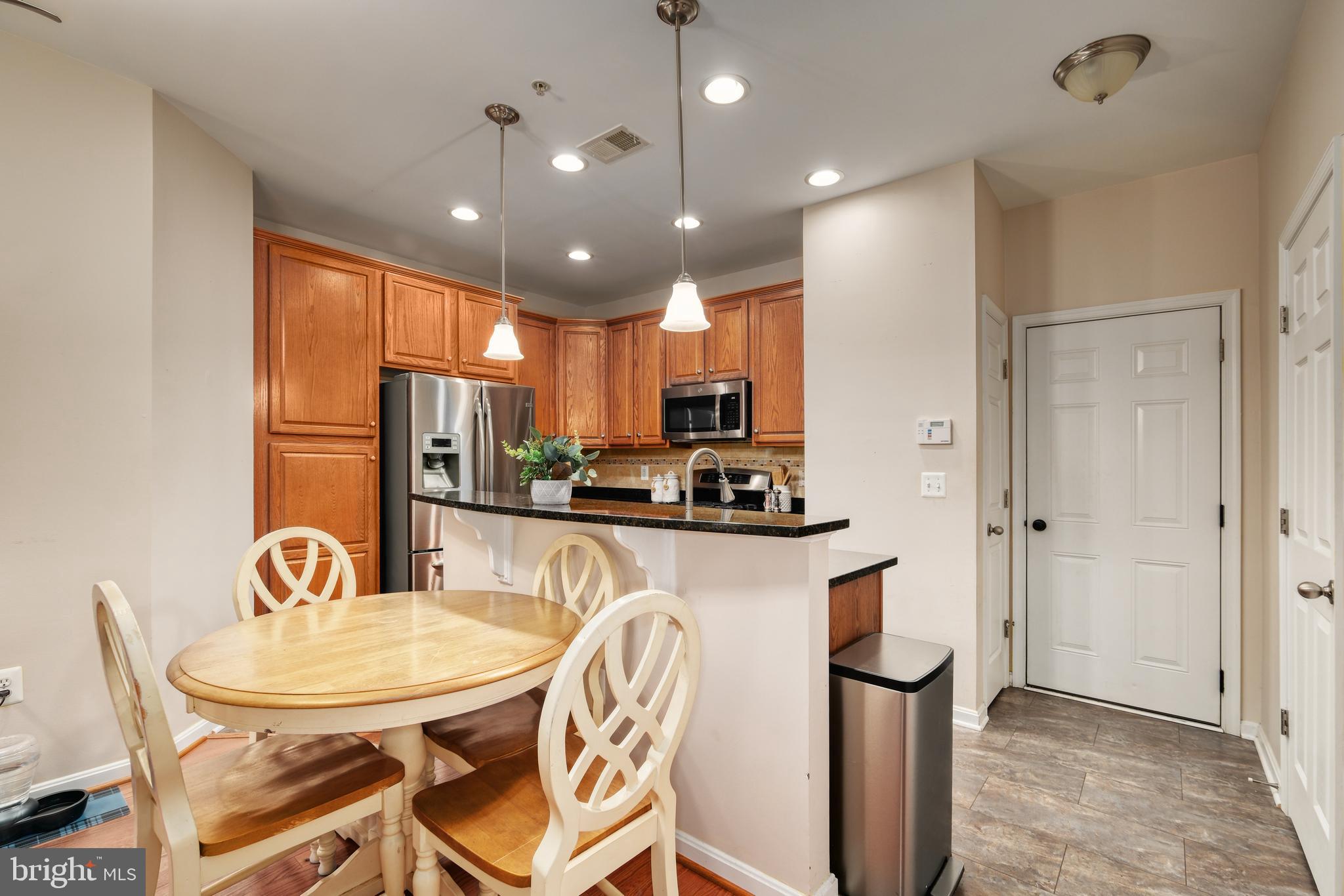 9583 Center Street Manassas, VA 20110 - Photo 15 of 34 LR is open to dining area and kitchen