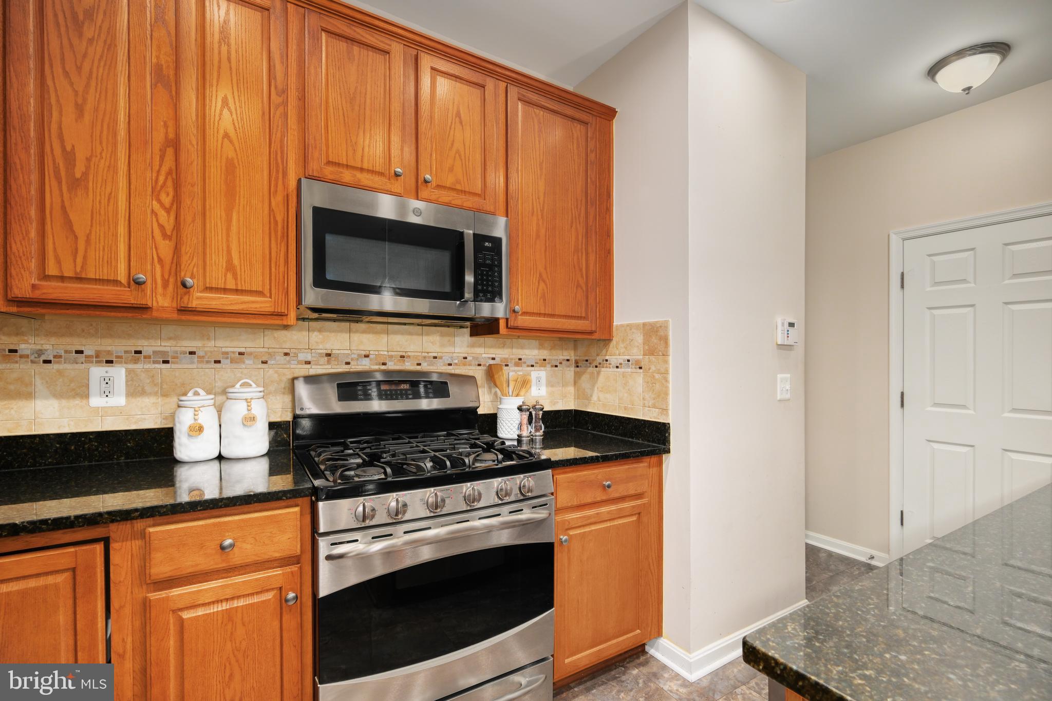 9583 Center Street Manassas, VA 20110 - Photo 18 of 34 Stainless appliances include gas range, DW, fridge