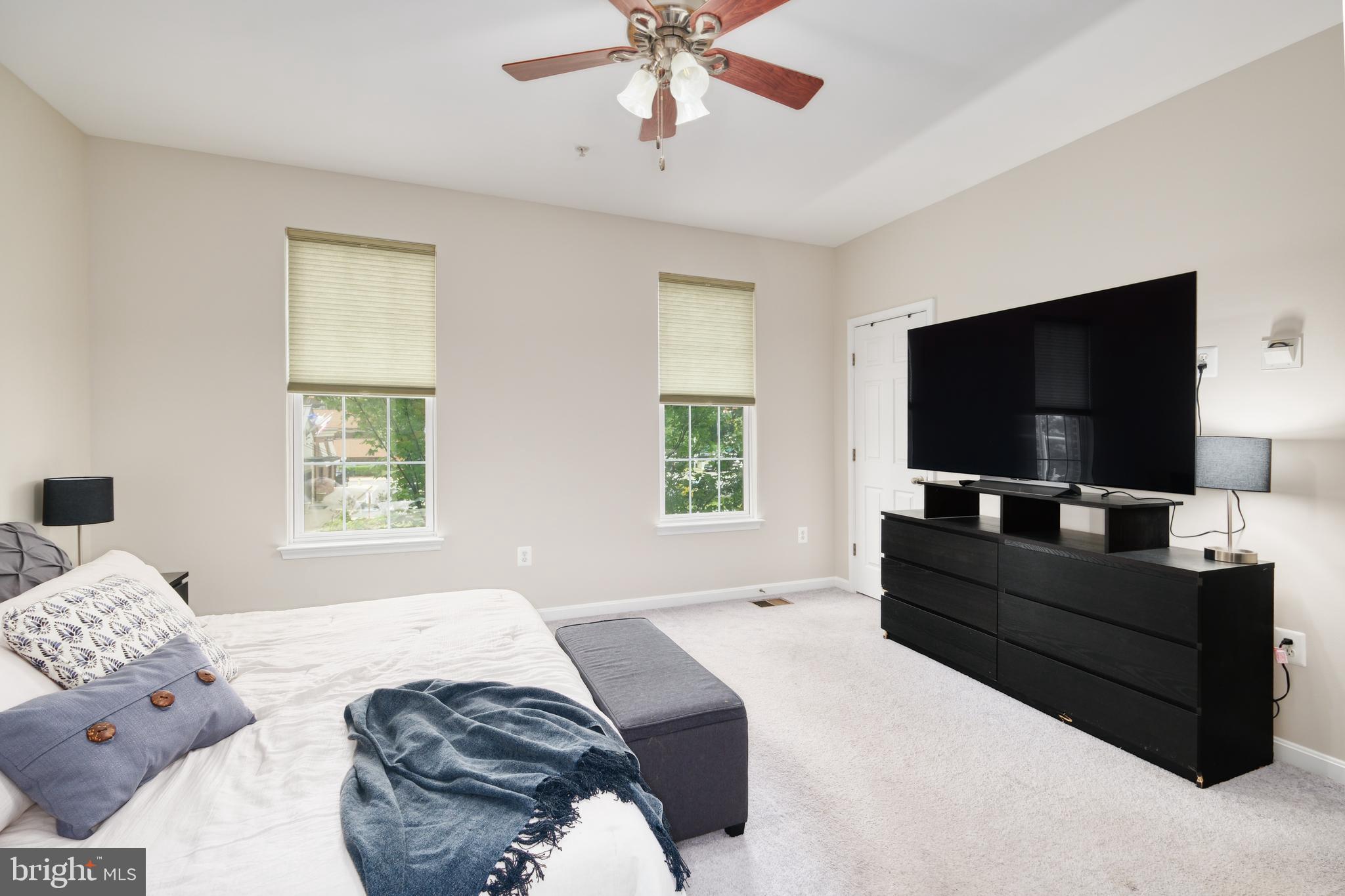 9583 Center Street Manassas, VA 20110 - Photo 22 of 34 Ceiling fan, carpet, window shades in primary BR