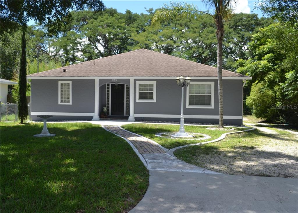 203 Deleon Road DeBary, FL 32713 - Photo 1 of 1 a view of a house with a yard and large tree