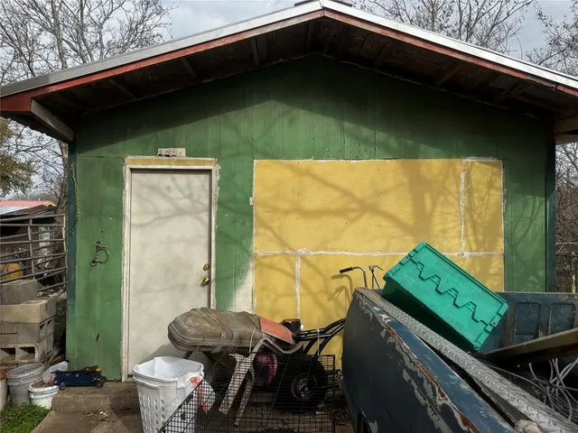 a backyard of a house with outdoor seating