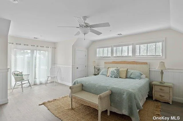 a kitchen with sink cabinets and wooden floor