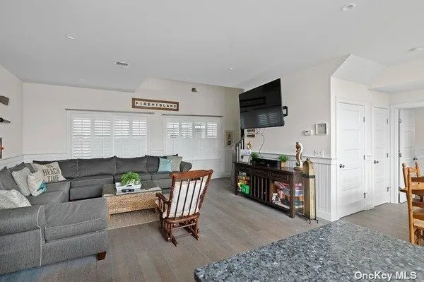a view of a patio with a table and chairs